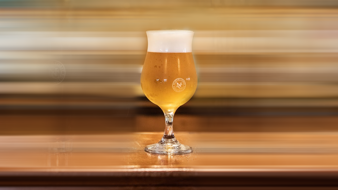Golden colored pour of North Coast Brewing's Le Merle